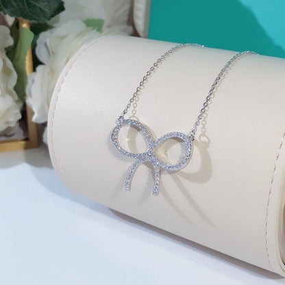 [⭐JeweliWhal]CLAW SET RHODIUM PLATED BOW NECKLACE